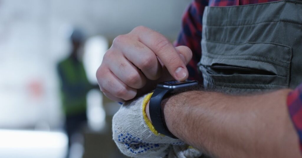 Screenshot of a smartwatch displaying health metrics like heart rate and stress levels, essential for construction workers' safety.